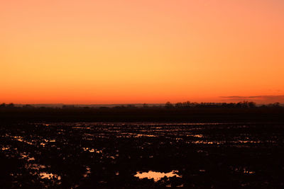 Scenic view of silhouette landscape against sky during sunset