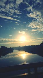 Scenic view of lake at sunset