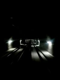 Cars moving on illuminated tunnel