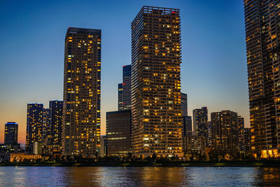 Illuminated buildings in city at night