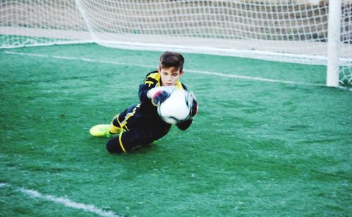 Man playing with ball in background