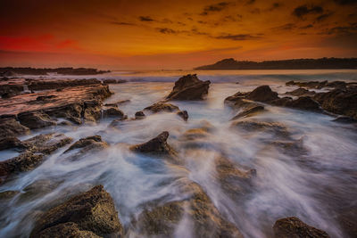 Scenic view of sea against sky during sunset