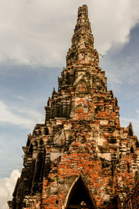 Low angle view of old building in ayutthaya province under the blue sky