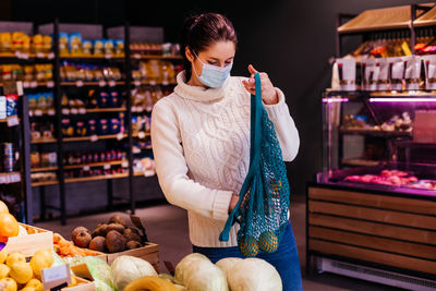 Woman holding ice cream at store