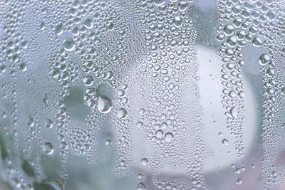 Full frame shot of wet glass window