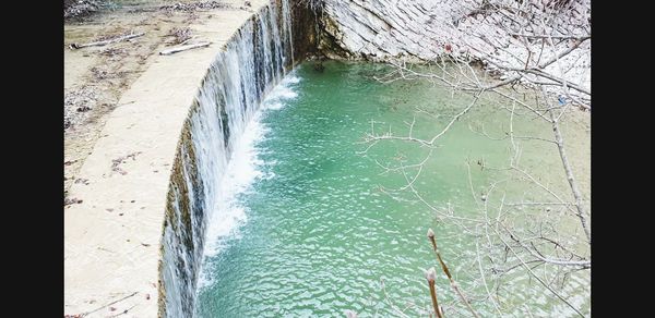 High angle view of water flowing over sea