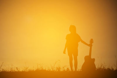Silhouette of father at sunset