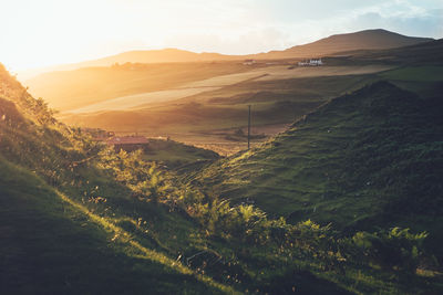 Scenic view of landscape against sky during sunset