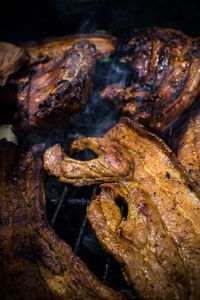 High angle view of meat on barbecue