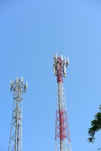 Low angle view of communications tower against sky