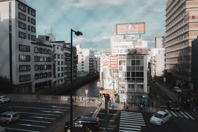 City street and buildings against sky