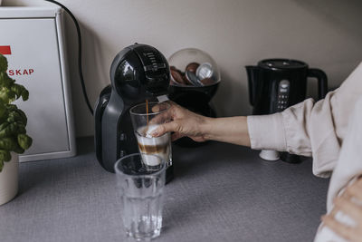 Woman preparing coffee