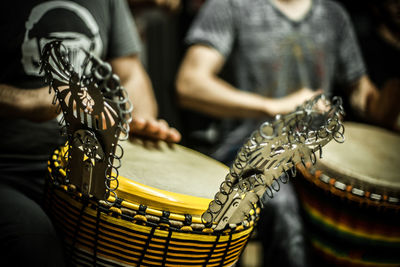 Close-up of man playing guitar