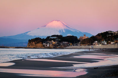 View of snowcapped mountain against sky during winter