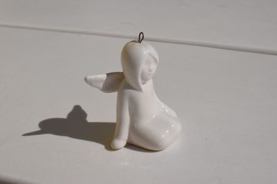 High angle view of figurine on table