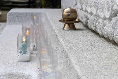 High angle view of illuminated candles in temple