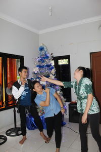 Woman standing against the wall