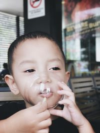 Close-up of boy looking away