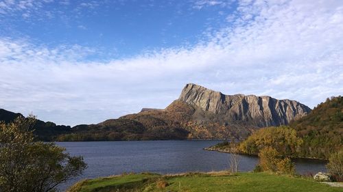 Scenic view of lake and mountains against sky