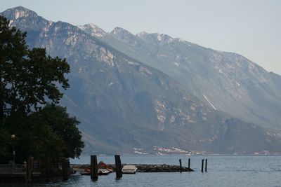 Scenic view of sea and mountains against sky