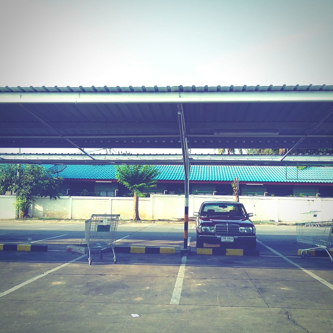 transportation, car, architecture, no people, built structure, day, stationary, parking garage, clear sky, outdoors, sky