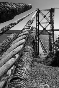 Close-up of rope tied to bridge