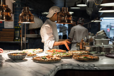 Man preparing food on table