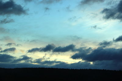 Low angle view of silhouette trees against sky during sunset