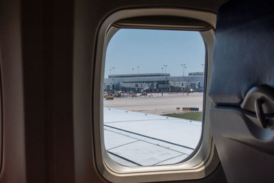 Aurora co usa june 7 2021  people on a plane, watch workers fixing a runway in a colorado airport