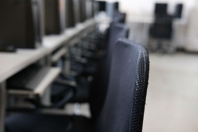 Close-up of empty seats in rack