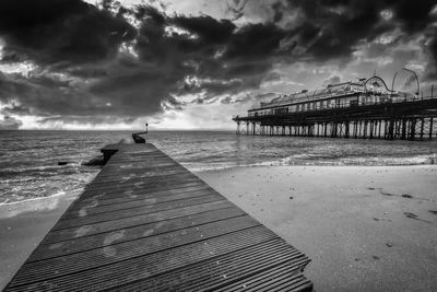 Pier over sea against sky