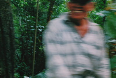 Blurred motion of man on grass