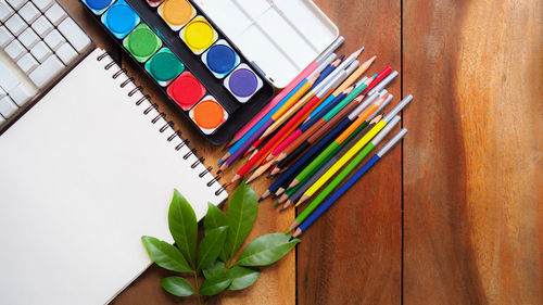 High angle view of multi colored pencils on table