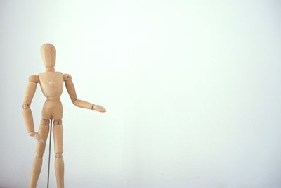 Statue of buddha against wall