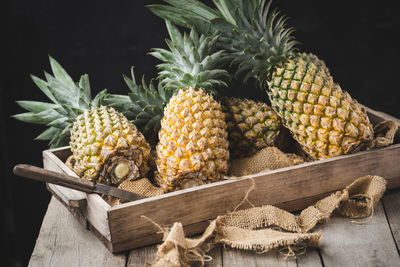 Fresh pineapples on the dark background