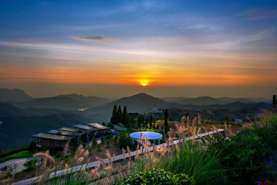 Scenic view of mountains against sky during sunset