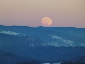 Scenic view of mountains against sky during sunset