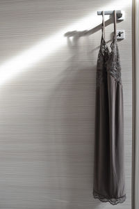 Close-up of clothes hanging on floor