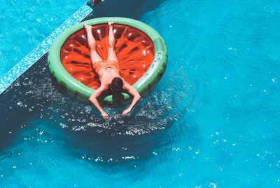 High angle view of man on ring in swimming pool