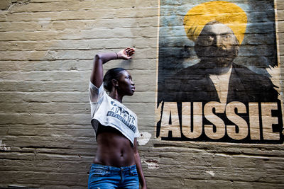 Woman standing against wall