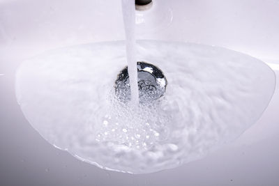 High angle view of water splashing in bathroom