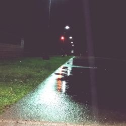 Wet road at night