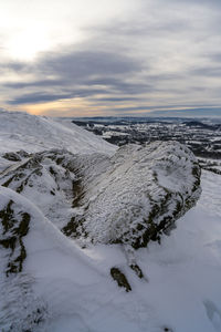 Scenic view of snow covered landscape against sky