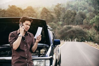 Man repairing car