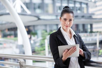 Portrait of a young woman using smart phone