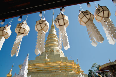 Low angle view of temple hanging outside building