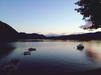 Scenic view of calm lake at sunset