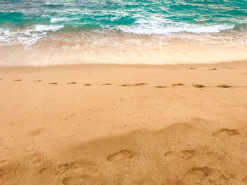 High angle view of waves rushing towards shore