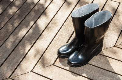 High angle view of shoes on wooden floor