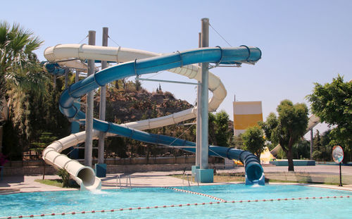 View of swimming pool against blue sky